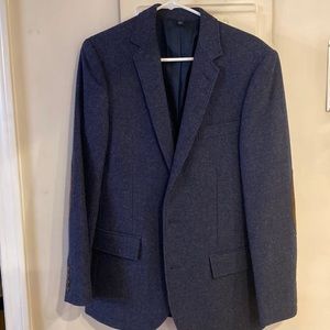 Like new blue wool sports jacket with brown suede elbow patches.